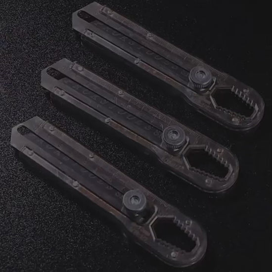 Cutter avec lame rétractable gris